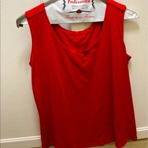 Sleeveless, cropped, red top with thick shoulder straps. US size small